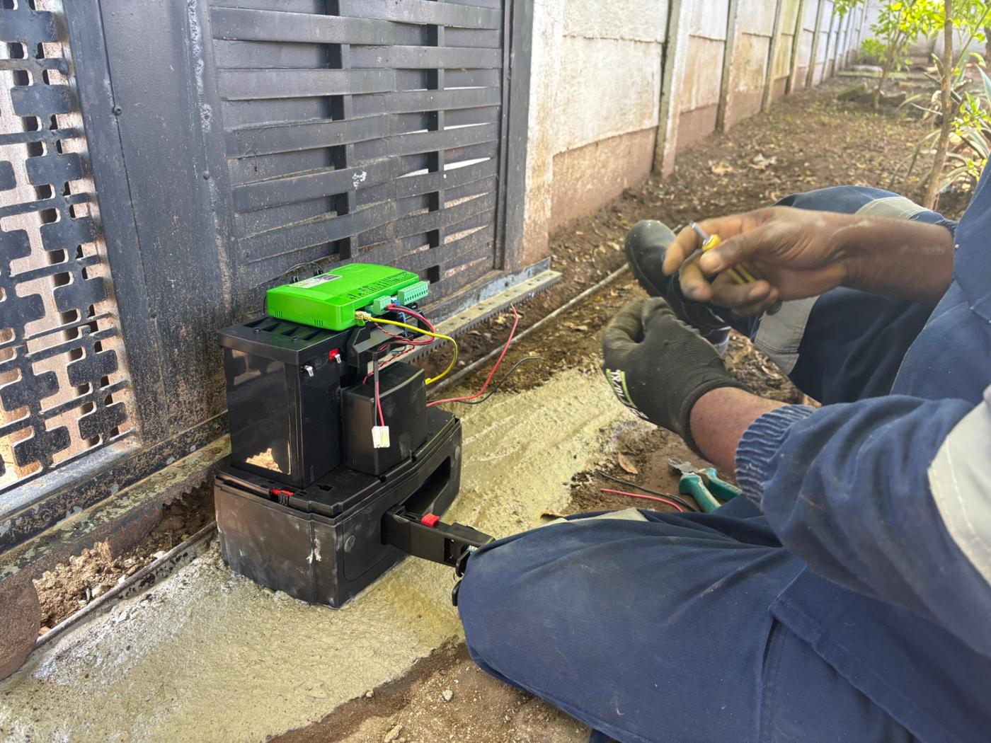 Lukiya Group technician working on the Centurion D5 SMART+ controller at the Esther Park gate